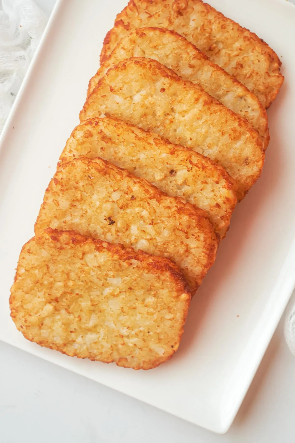 Golden crispy hash browns breakfast side at Fluff and Crunch in Warman, SK